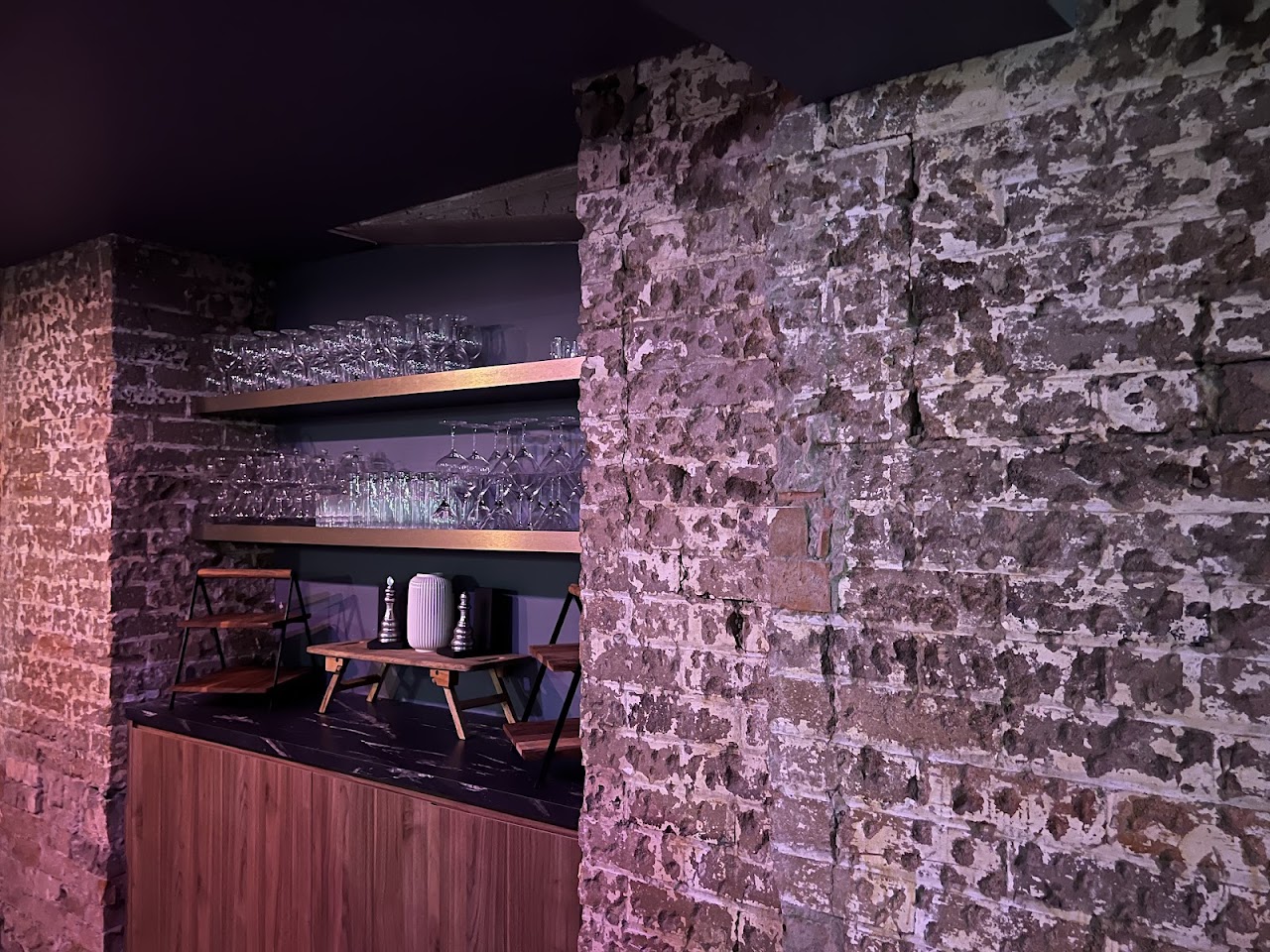 Exposed heritage brickwork inside The Fox Hole