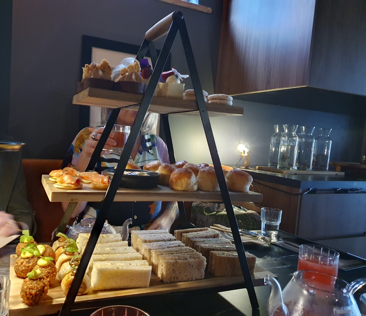 Gin high tea stand with savoury and sweet bites